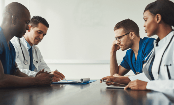 doctors discussing about documents and work doctors discussing about documents and work
