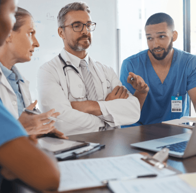 doctors in a meeting reviewing presentation